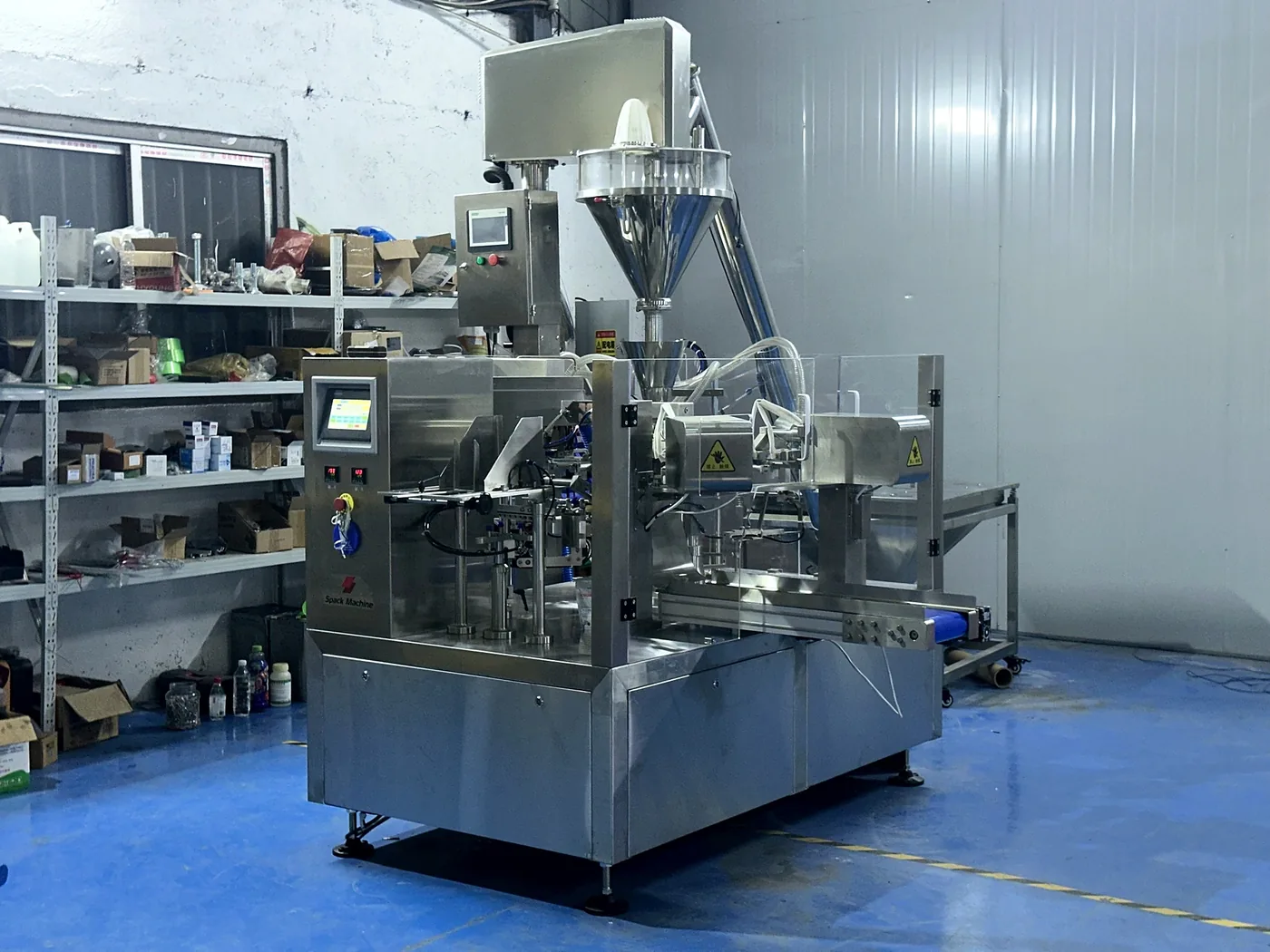 Rotary premade pouch packaging system on the assembly floor