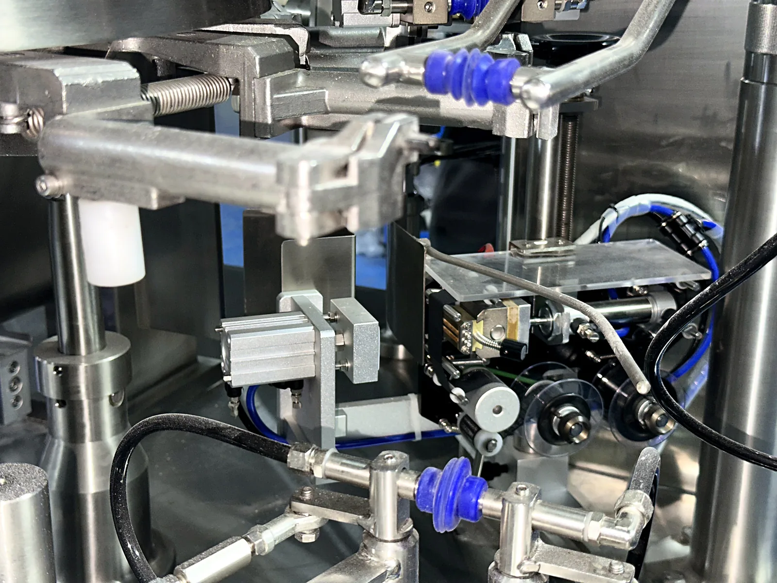 Pouch handling mechanism inside a rotary premade pouch packing machine.